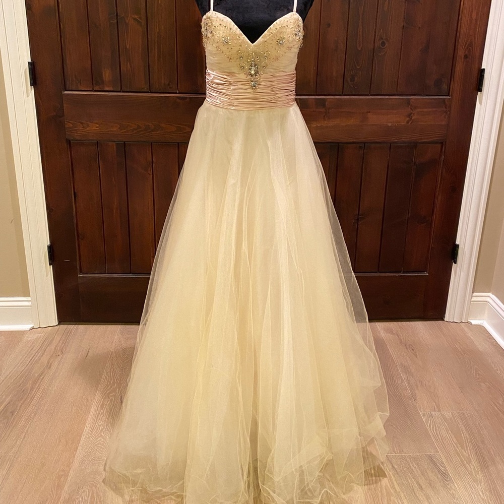Gold prom dress worn once. In great condition.